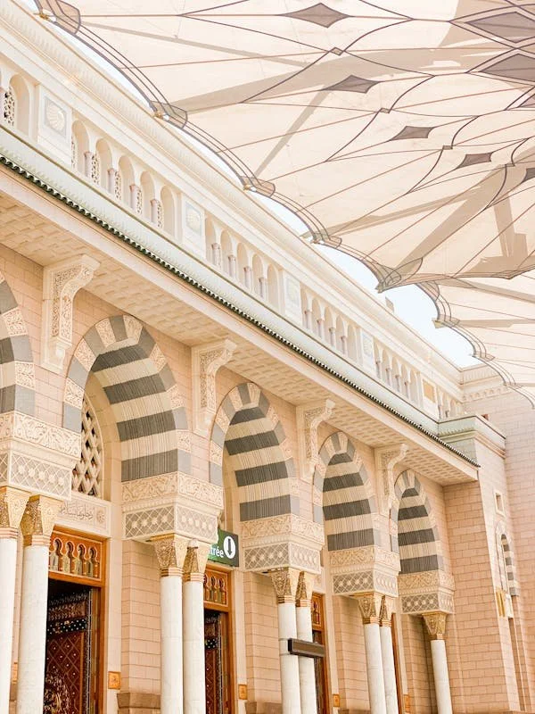 Detailed arches and shade canopies at the Prophet's Mosque in Madinah